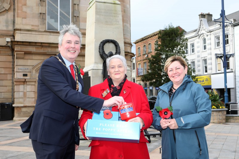 The Mayor of Causeway Coast and Glens Borough Council, Councillor Richard Holmes makes a donation to the Poppy Appeal with fundraiser Breeze Galbraith and Council’s Veterans’ Champion Alderman Sharon McKillop