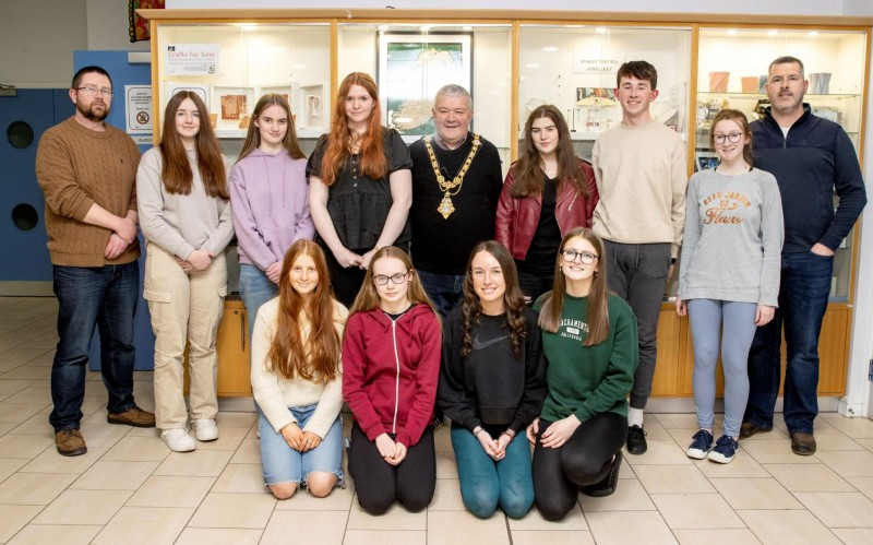 Causeway Coast & Glens Borough Council Mayor, Councillor Ivor Wallace, Nic Wright, Museum Services Community Engagement Officer and Gerard McIlroy, Good Relations Officer alongside the young musicians who performed at the Shared Music of Dalriada event in Flowerfield Arts Centre, Portstewart.