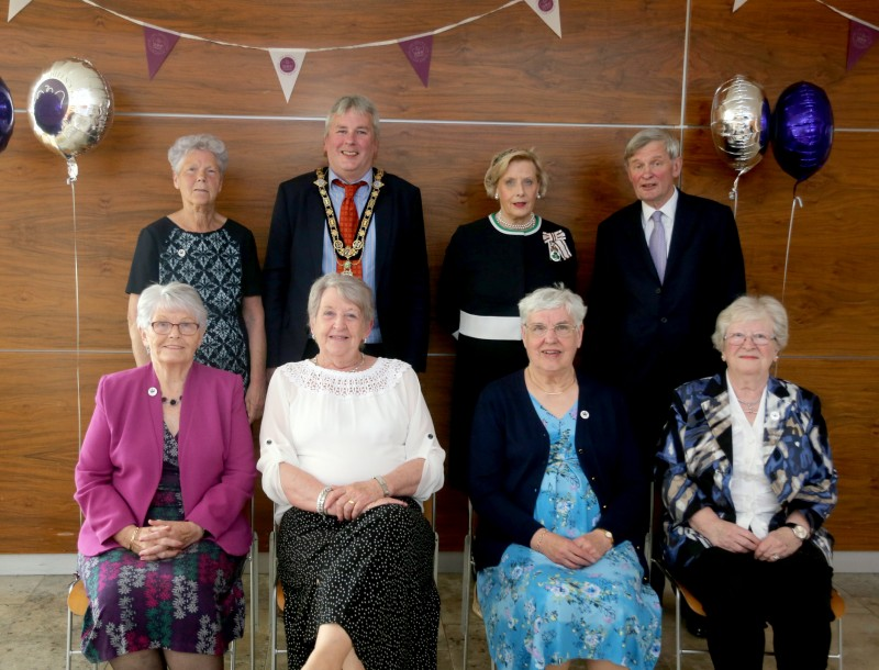 The Mayor of Causeway Coast and Glens Borough Council Councillor Richard Holmes pictured with representatives of the Evergreen Club, Lord Lieutenant of County Antrim Mr David McCorkell and Lord Lieutenant of County Londonderry Mrs Alison Millar at the reception held in Cloonavin for recipients of the Queen’s Award for Voluntary Service.
