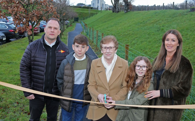 Members of the Connolly family cut the ribbon on a new walking path which has been dedicated to former long-serving local Councillor Harry Connolly.