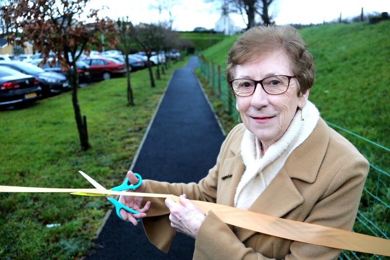 Philomena Connolly prepares to cut the ribbon on the new walking path, which has been dedicated to her husband Harry, a former long-serving local Councillor Harry Connolly.