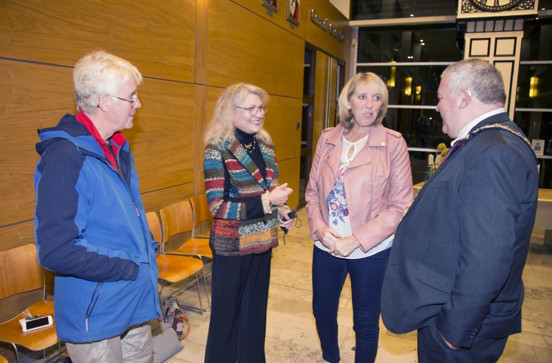 Mrs Dunlop, Emerald Kilpatrick and Diane Jinks speak with the Mayor of Causeway Coast and Glens Borough Council, Councillor Ivor Wallace, during the event in Cloonavin.
