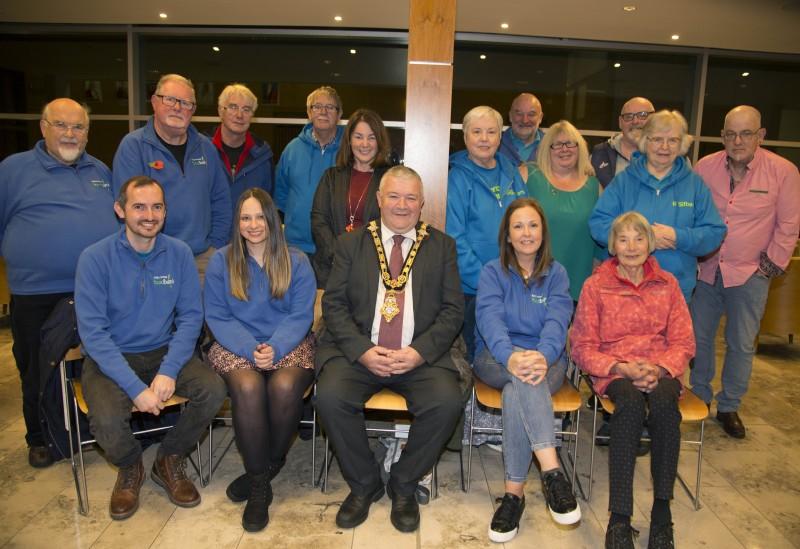 The Mayor of Causeway Coast and Glens Borough Council Councillor Ivor Wallace pictured with some of those from Ballymoney Foodbank who attended the event in Cloonavin to recognise the work of local Food Banks and Christians Against Poverty.
