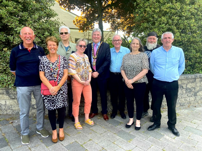 The Mayor of Causeway Coast and Glens Borough Council Councillor Richard Holmes pictured with the group who he welcomed to the Council offices in Limavady.
