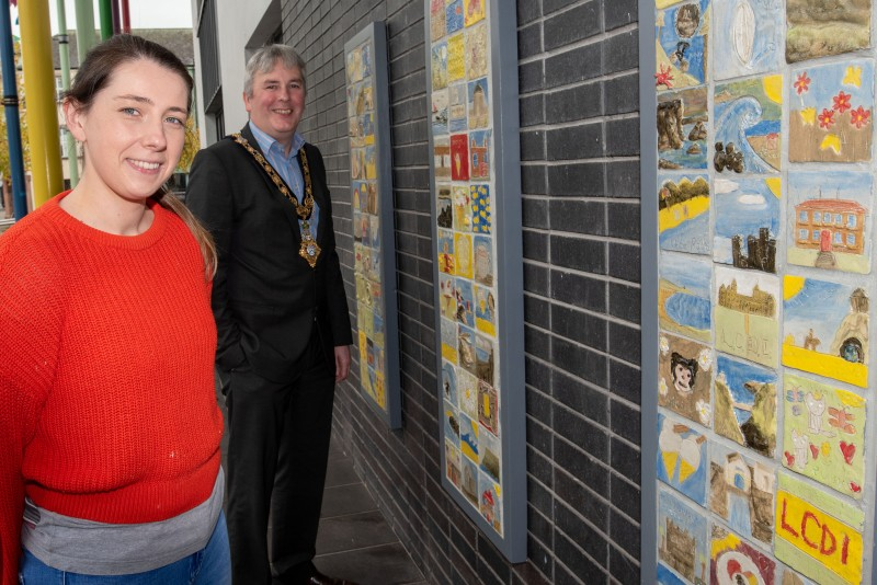The Mayor of Causeway Coast and Glens Borough Council, Councillor Richard Holmes views the ‘Our Story in the Making’ community artwork on display at Drumceatt Square in Limavady with artist Fiona Shannon.