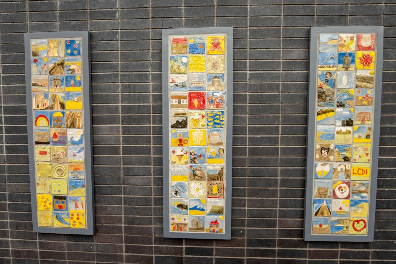 The ‘Our Story in the Making’ community artwork consisting of 100 colourful ceramic tiles made by 100 individuals from across the borough is on display at Drumceatt Square outside Roe Valley Arts and Cultural Centre in Limavady.