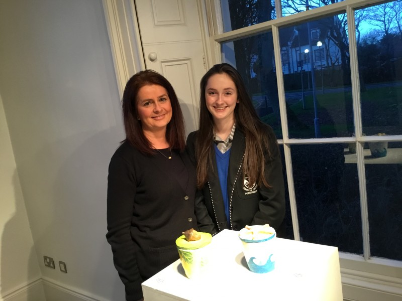GCSE student Rebekah Dunbar from Dominican College pictured with her mother Siobhan Dunbar as she presents her art work currently featuring in The Dominican Collective Exhibition at Flowerfield Arts Centre in Portstewart.
