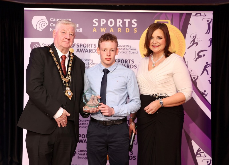 Junior Sportsman of the Year, Riley Brown at the 2023 Sports Awards with host Denise Watson and Mayor of Causeway Coast and Glens, Councillor Steven Callaghan.