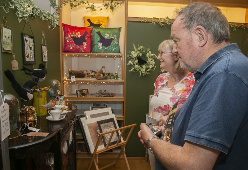 Customers browse some of the products available at Stone Row Artisans in Coleraine during the recent celebration event.