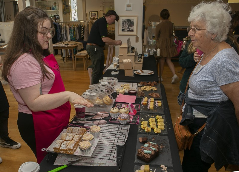 A customer browses the selection on offer from CeCe's Cakes and Bakes at the Stone Row Artisans celebration event to mark the 1st birthday of their retail space in Coleraine town centre.