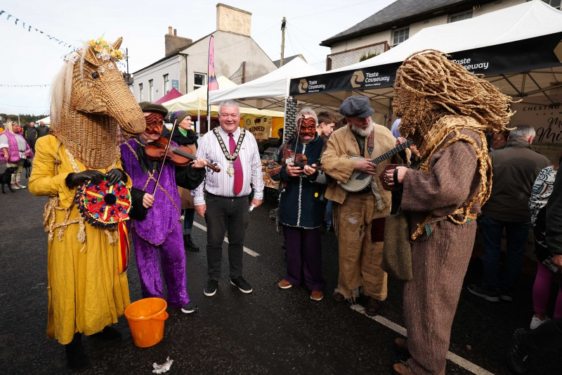 The Mayor of Causeway Coast and Glens Borough Council, Councillor Ivor Wallace enjoys the sounds of the Armagh Rhymers at the Salmon and Whiskey Festival.
