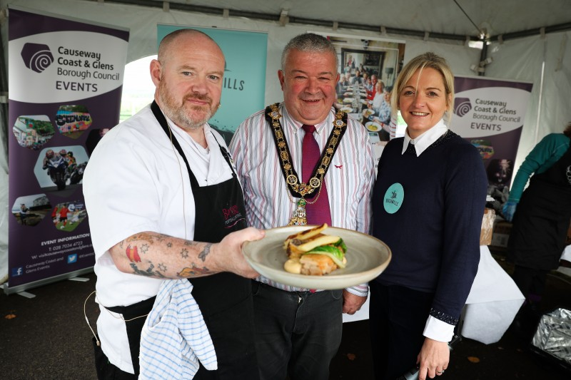 Kevin Farren from the Bayview Hotel in Portballintrae pictured with the Mayor of Causeway Coast and Glens Borough Council, Councillor Ivor Wallace, and Wendy Gallagher of Causeway Coast Foodie Tours.