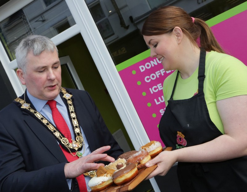 The Mayor of Causeway Coast and Glens Borough Council Councillor Richard Holmes is shown some of the sweet treats on offer at Three Queens, Coleraine’s new donut and dessert bar located on Railway Road by owner Kirsty Nicholl.