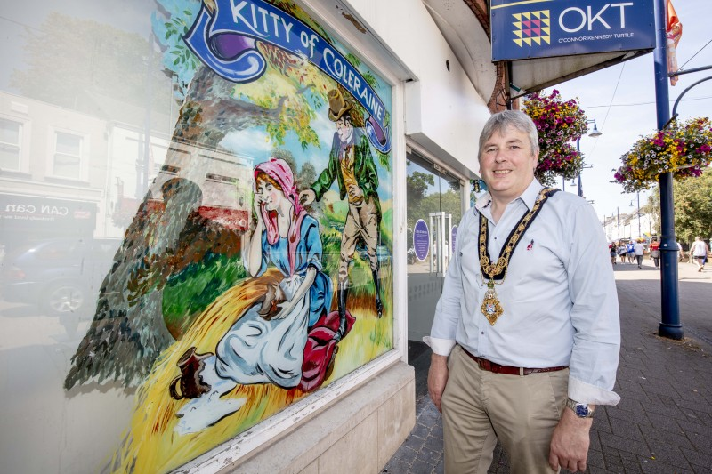 The Mayor of Causeway Coast and Glens Borough Council Councillor Richard Holmes pictured during a recent visit to Coleraine town centre to view the shop window artworks created by local artist Mark Christie.