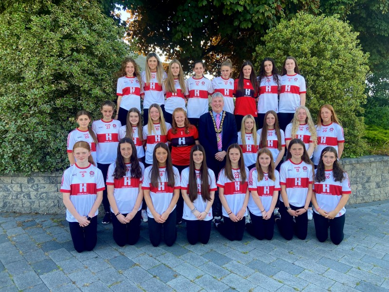 The Mayor of Causeway Coast and Glens Borough Council Councillor Richard Holmes pictured with the All-Ireland winning Derry Under-14 ladies football team.