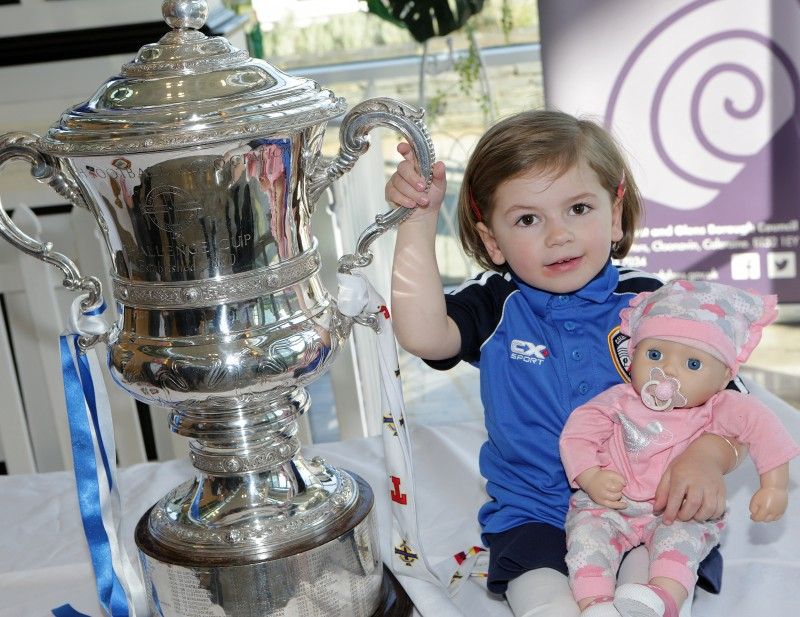 Little Sienna, daughter of Alderman Alan Robinson and one of Coleraine FC’s youngest fans, gets her hands on the cup at the civic reception.