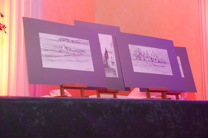 Sketches by Hector McDonnell, including an image of Ballintoy Church, were presented to Joan Christie CVO OBE on the night.