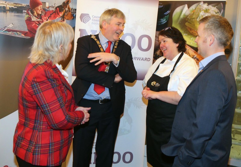 The Mayor of Causeway Coast and Glens Borough Council Councillor Richard Holmes chats with chef Paula McIntyre, Alderman Michelle Knight McQuillan and Councillor John McAuley at the celebration of local produce.