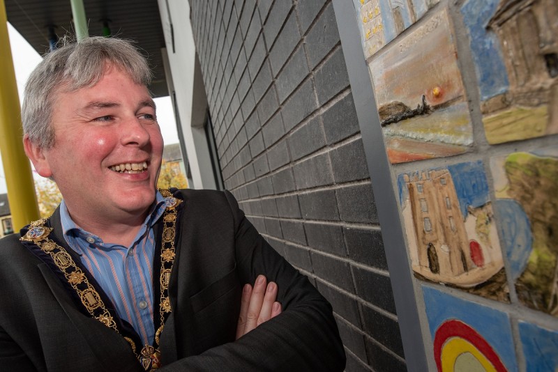 The Mayor of Causeway Coast and Glens Borough Council, Councillor Richard Holmes views the tiles created as part of the ‘Our Story in the Making’ community artwork at Roe Valley Arts and Cultural Centre.