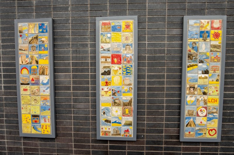 The ‘Our Story in the Making’ community artwork consisting of 100 colourful ceramic tiles made by 100 individuals from across the borough is on display at Drumceatt Square outside Roe Valley Arts and Cultural Centre in Limavady.