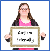 A child holding a sign that says autism friendly