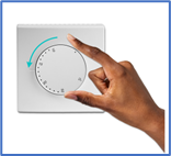 A hand turning a dial on a white device Description automatically generated