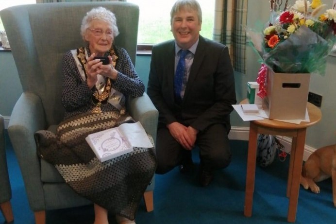 Centenarian receives bespoke coin from Mayor of Causeway Coast and Glens Borough Council