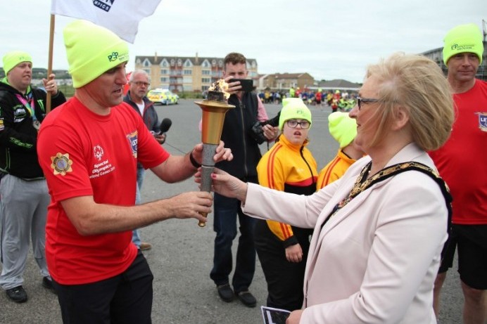 Mayor welcomes Special Olympics Flame of Hope to Portrush